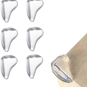 Six transparent silicone babies table corner protectors arranged on white background