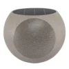 Victrola Zen Premium Solar Garden Speaker In Stone Finish Placed In A Garden Layout